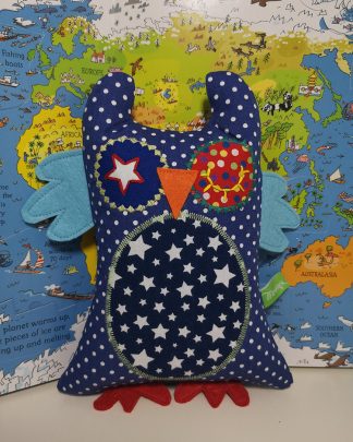 Blue and red polka dot baby owl