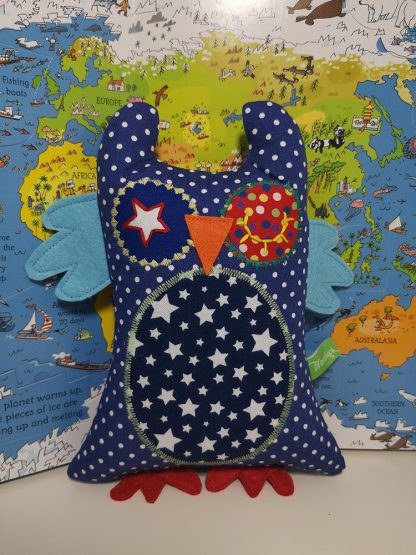 Blue and red polka dot baby owl